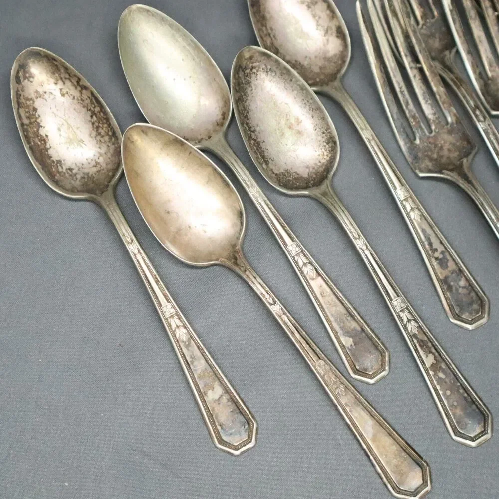 W M Rogers Flatware 12 piece set 4 spoons, 6 forks, butter knife and sugar spoon